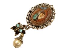 Nostalgic, unique brooch in a classy antique design. The brooch is made of antique silver-colored metal and a hand-crafted glass cabochon that shows a beautiful motif with an Art Nouveau lady and butterflies. A pendant with a shell pearl and a butterfly charm, decorated with high-quality rhinestones, are attached to the bottom of the brooch. The brooch, including the pendant, measures 6.4 L x 2.9 W cm. Art Nouveau Cabochon Brooches As Gifts, Antique Silver Vintage Brooches As Gift, Victorian Style Brooches For Gift, Cabochon Brooches As A Gift, Victorian Antique Silver Brooch For Gift, Victorian Antique Silver Brooches As Gift, Victorian Antique Silver Brooch, Art Nouveau Lady, Unique Brooch