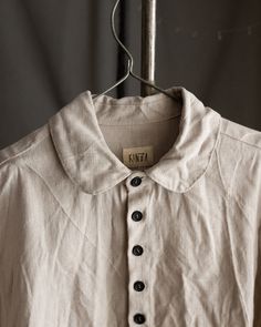 Men's linen shirt JOHN This shirt is made of 100% natural high-quality linen, egg heavy linen is at the pictures. It has a button closure with tightly placed buttons, rounded collar, straight hem and no cuffs. Collar and sleeve hems are hand stitched with natural linen thread. Buttons are made of hand dyed coconut or palm tree. All the materials are prewashed to avoid shrinkage. Total length is 74cm. Vintage Linen Shirt With Button Closure, Vintage Linen Shirt With Relaxed Fit, Vintage Linen Shirt With Buttons, Cream Linen Tops With Buttons, Cream Linen Top With Buttons, Vintage Collared Linen Shirt, Vintage Linen Collared Shirt, Classic Cream Linen Shirt, Mens Linen Jackets