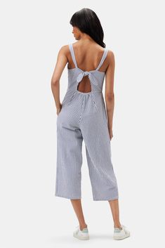 Make seasonal dressing a breeze in the Taya Jumpsuit—a one-and-done favorite, refreshed in organic cotton seersucker. Sleeveless wide-legged jumpsuit with a fitted bodice, elastic, and tie a back 100% Organic Cotton Seersucker 26 1/2" Inseam Ethically Made in India Casual Spring Jumpsuits And Rompers For Picnic, Summer Striped Cotton Jumpsuits And Rompers, Striped Cotton Jumpsuits And Rompers For Summer, Casual Summer Jumpsuits And Rompers For Picnic, Spring Striped Cotton Jumpsuits And Rompers, Striped Cotton Jumpsuits And Rompers For Spring, Summer Relaxed Fit Jumpsuits And Rompers For Daywear, Summer Cotton Jumpsuits And Rompers For Daywear, Striped Cotton Jumpsuit For Day Out