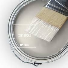 a paint can with a brush inside of it