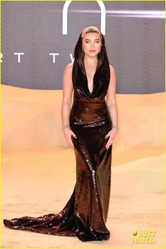 lady in black dress at the star wars european premiere with her hands on her hips