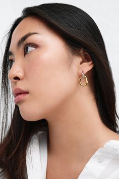 Our Suki Two-Toned Hoops are a minimalist exploration of duality, featuring two mixed metals, handcrafted from brass with rhodium and 18k gold plating, entwined in elegant harmony. True to her contrasting style, Suki is the perfect accessory for days and nights, casual and formal events, now and forever. Each pair includes a Marcella-branded vegan leather travel case for safe storage and easy travel.[SPLIT] Available in one size. Approximately 1” (2.5 cm) in height. Brass with 18KT yellow gold p Contemporary Everyday Gold Jewelry, Contemporary Polished Finish Everyday Jewelry, Contemporary Metal Jewelry For Everyday, Contemporary Everyday Metal Jewelry, Gold Sterling Silver Jewelry With Modern Twist, Contemporary Gold Metal Jewelry, Modern Twist Brass Jewelry In Gold Color, Modern Twist Everyday Polished Jewelry, Modern Twist Gold Brass Jewelry