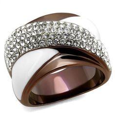 Description Ooze effortless glamour and elegance with this stunning two-tone women's stainless steel ring. Studded with several sparkling top-grade clear crystal stones, this white epoxy accented stainless steel band adds an extra layer of luxury to any outfit. Suitable for cocktail parties, soirees, and other occasions. Product Features: Stainless steel two tone ring Clear color top grade crystal stones Stone shape: round Stone setting: pave Two-tone light brown ion plated finish Ring size: women's 5 Weight (approx): 11.27 (g) Material(s): stainless steel/crystal/epoxy Product Specifications Weight Width Height Depth 0.02 LBS 3.00" 3.00" 3.00" Warning: CHOKING HAZARD-Small Parts Adult Supervision Required. Epoxy Crystal, Chest Jewelry, Two Tone Ring, Anniversary Rings For Her, Unique Mens Rings, Brown Rings, Engagement Rings Sale, Vintage Gold Rings, Luxe Jewelry