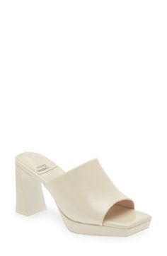 A dramatic heel adds a sculptural look to this eye-catching platform slide sandal with a single wide strap and a squared-off toe. 3 1/2" heel; 1" platform (size 8.5) Leather or synthetic upper/leather lining/synthetic sole Imported Women's Clothing