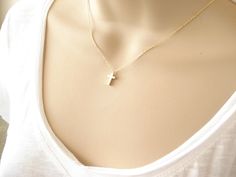 "This 10mm tiny and dainty celebrity inspired Cross necklace is perfect for your everyday, birthday gift and bridesmaid gift. * I ship in 1- 3 days in a gift box from California * Chain: Gold or Rhodium plated over brass * Cross Pendant: gold or rhodium plated over brass,10 x 6mm {Custom - Extra long Chain} If you would like a longer chain (20\" to 34\"), please add this in your cart after select any necklace length. https://www.etsy.com/listing/614040250/extra-long-chaingold-silver-or-rose-gold Cheap Dainty Cross Necklace, Tiny Gold Cross Necklace, Dainty Gold Cross Necklace For Baptism, Dainty Cross Pendant Necklace For Baptism, Dainty Charm Necklace With Cross Pendant, Tarnish Resistant, Cross Necklace Gold, Tiny Cross Necklace, Tiny Cross, Gold Cross Necklace