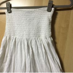 An Adorable Tube Top That Can Also Be A Mini Dress Or Cover Up! In A White Color, Tube Style At Top Then Flows Down, With A Lace Trim Edge And Slight Sequins Details. Can Fit An Xsmall To Small. Stretchy. Brand New With Tag. Questions Welcomed. White Stretch Sundress For Summer, Cotton Dresses With Elastic Waistband For Day Out, Cotton Dress With Elastic Waistband For Day Out, Sleeveless Cotton Dress With Elastic Waistband, Casual Sleeveless Maxi Dress With Elastic Waistband, Stretch Cotton Maxi Dress For Beach, White Cotton Mini Dress With Smocked Back, Casual Strapless Cotton Sundress, White Stretch Dresses With Smocked Back