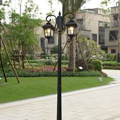 a couple of street lamps sitting on top of a sidewalk