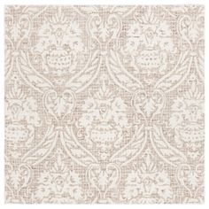 a beige and white rug with an intricate design