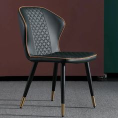 a green chair sitting on top of a carpeted floor next to a brown wall