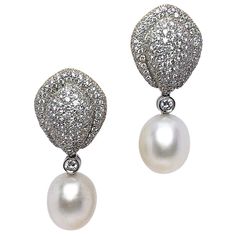 Cellini Jewelers NYC 18KT White Gold earrings, are composed of 3.91 carats of diamonds and 14.5mm X 12mm South Sea Pearls. Approximately 300 round diamonds make up the beautiful bombe design. Earrings measure approximately 1.5" in length Clip on with collapsible post. Appraisal from Cellini Jewelers NYC upon request. White Gold Drop Earrings, Pearl Jewels, Pearl And Diamond Earrings, Miriam Haskell, Design Earrings, White Gold Earrings, South Sea Pearls, Sea Pearls, Editing Service