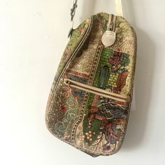 Hello there vintage lovers! I bring you a very unique purse. Tapestry style bag has a interesting Ottoman art print. Handle at the top. Zipper down the middle. Please see the wear in the photos. Most likely from the 1940s. Measurement: 8" wide 13" tall Thank you for stopping by! *Note about my packaging. I like to do my part to help the environment so because of that I reuse boxes. So your order may come in a recycled or a box that had a previous life. Yay for recycling! Follow @windfallvtg on Instagram for sneak peeks, shop updates, and sales! Vintage Backpack-style Shoulder Bag For Travel, Vintage Backpack Style Shoulder Bag For Travel, Vintage Handmade Shoulder Bag For Travel, Vintage Beige Rectangular Bag, Vintage Rectangular Beige Bag, Vintage Leather Backpack Shoulder Bag, Vintage Beige Shoulder Bag, Vintage Leather Shoulder Backpack, Vintage Canvas Shoulder Bag