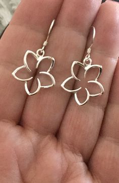 ".925 Sterling Silver Hawaiian Plumeria Large dangle Earrings. The size is 17MM, just under 3/4\". Top-selling collection in our Hawaii stores. The Highly-reflective Sterling finish is beautiful, nickel-free and long-lasting. These will shine for years to come. --The Plumeria is given here in Hawaii as a symbol of love and friendship. Handmade with Aloha in Maui. Packaged ready for gifting with a Hawaiian Plumeria story, Sterling silver cleaning instructions, jewelry pouch and gift box. Practice Silver Flower Jewelry With Matching Earrings, Delicate Silver Earrings With Flower Charm, Delicate Silver Flower Earrings Nickel Free, Delicate Silver Nickel-free Flower Earrings, Delicate Silver Flower Earrings Nickel-free, Silver Delicate Nickel-free Flower Earrings, Delicate Silver Drop Flower Earrings, Silver Pierced Flower Earrings For Gift, Elegant Sterling Silver Earrings With Flower Pendant