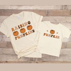 "fall vibes,hello fall shirt,pumpkin spice shirt,fall season shirt,fall vibes shirt,pumpkin sweatshirt,kids thanksgiving,girl turkey shirt,baby thanksgiving,boys thanksgiving,grateful shirt,girl thanksgiving,kids fall shirt,family shirt,matching shirts,family shirts,mama shirt,baby shower gift,new mom gift,mom shirt,mommy and me shirt,mama and mini shirt. Introducing our latest mommy and me shirts! These cute and funny shirts feature witty definitions of \"mama\" and \"mini\" that are sure to ma Family Matching Short Sleeve Tops For Fall, Cute Pre-shrunk Shirt For Fall, Family Letter Print Tops For Fall, Fall Tops With Letter Print, Cute Thanksgiving Shirts Mom And Me, Casual Family T-shirt For Fall, Mom And Son Matching Fall Shirts, White T-shirt For Fall Family Matching, Mommy And Me Thanksgiving Shirts