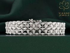 Experience the allure of sustainable luxury with our 9.13 TCW Marquise-Cut Lab-Grown Diamond Bracelet. Each meticulously selected diamond showcases the quintessential marquise cut, renowned for its boat-shaped elegance that elongates and flatters the wrist. Set in a harmonious design, these lab-grown diamonds not only mirror the brilliance and fire of natural diamonds but also represent a conscious choice for the modern aficionado. This bracelet is a testament to timeless beauty, ethical craftsmanship, and unparalleled sophistication. Perfect for both grand soirées or intimate celebrations, it promises to be a cherished addition to any jewelry collection. 💎 BRACELET Features: → Shape: MARQUISE CUT  → Carat: 9.13 TCW → Color: G+ → Clarity: VS+ As the listed ring is a custom order, there ma Marquise Diamond Bracelet, Diamond Mirror, Lasting Love, Wedding Jewelry Bracelets, Marquise Cut Diamond, 19 Days, Marquise Diamond, Marquise Cut, Precision Cut