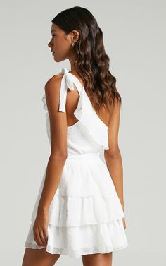 Darling I Am A Daydream Mini Dress In White | Showpo Flirty Ruffled Mini Dress For Garden Party, Summer Bridesmaid Dress With Tiered Skirt, Summer Bridesmaid Dress With Ruffled Skirt, Mini Ruffle Dress For Garden Party, Brunch Mini Dress With Ruffle Hem And Ruffled Straps, Brunch Mini Dress With Ruffle Hem And Straps, Brunch Mini Dress With Ruffled Straps And Ruffle Hem, Chic Bridesmaid Dress With Ruffled Skirt, Party Mini Dress With Tie Back And Ruffled Straps