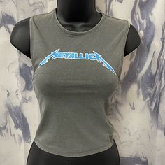 Cotton On Metallica Shirt Brand New Nwt Size Xs Womens Size Xs Shown On Mannequin ***Size Xs & Large Available Metallica Color Blue On Logo! Amazing Quality Stretchy And Conforming To The Body Total Y2k Style! Early 90’s Grunge Punk Fitted Grunge Blue Top, Trendy Fitted Tank T-shirt, Fitted Graphic Print Casual Tank Top, Grunge Crew Neck Tank Top, Casual Fitted Tank Top With Graphic Print, Fitted Casual Tank Top With Graphic Print, Fitted Grunge Tank Top For Spring, Spring Grunge Tank Top, Fitted Grunge Tops For Spring