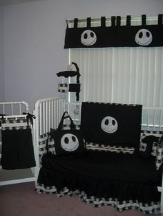 a black and white crib bedding set with jack skellingy faces on it