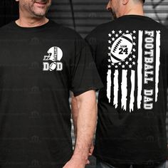 two men wearing black shirts with american flag and football logos on the front, one man has his hands in his pocket