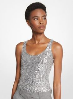 This sequined bodysuit will command attention whenever you slip it on. Made in Italy from stretch tulle, it features a seamless stretch-jersey base that disappears under tailoring and denim alike. Keep accessories pared back to let it fully shine. Elegant Stretch Bodysuit With Sequins, Fitted Embellished Evening Bodysuit, Glamorous Fitted Tank Top For Party Season, Stretch Scoop Neck Bodysuit For Parties, Glamorous Fitted Evening Tank Top, Elegant Sequined Stretch Tank Top, Elegant Stretch Sequin Tank Top, Glamorous Fitted Bodysuit With Sequins, Fitted Sequins Bodysuit Glamorous Style