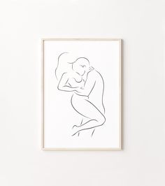 a black and white line drawing of a man hugging a woman's head in front of a white wall