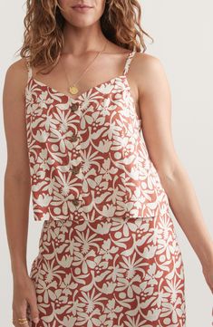 Tropical flowers make a cheery splash across this hemp-blend cami fashioned with a button placket. Front button closure V-neck Adjustable straps 54% hemp, 44% Tencel® lyocell, 2% spandex Tencel lyocell is a more-sustainably produced fiber made with closed-loop processing Machine wash, dry flat Imported V-neck Linen Tops With Floral Print, Floral Print Linen V-neck Top, Summer Tops With Spaghetti Straps And Button Closure, Linen Tops With Adjustable Straps For Vacation, Linen Top With Adjustable Straps For Vacation, V-neck Cotton Tank Top With Buttons, Cotton V-neck Tank Top With Buttons, Summer Floral Linen Top, Casual Summer Camisole With Buttons