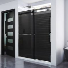 a modern bathroom with black and white decor