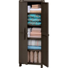 an open storage cabinet filled with folded towels