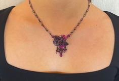 Colleen Toland Amythyst PurpleHandbeaded Pendant Floral Necklace.  The flowers and leaves are handpainted resin in purple with hints of fuchsia.  The chain is handmade with tiny purple seedbeads, jumprings and purple glass beads.  The closure is a hook with a 4 inch extender and there is a engraved tag with Colleens name. This is a quality piece of jewelry that will last a life time. Created by designer Colleen Toland who has been creating her unique style of vintage jewelry for more than 30 years. All of our pieces come with an engraved tag with Colleen's name so as you know you are receiving authentic Colleen Toland jewelry. Necklace measures 16 inches with a 4 inch extender so as you can change the length depending on the neckline you are wearing. It has a lobster claw closure that is v Floral Beadwork, Jewelry Flower, Floral Necklace, Purple Glass, Life Time, Necklace Handmade, Flower Necklace, Hand Beading, Artisan Jewelry