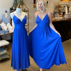 Our Cobalt Blue With Gold Thread Maxi Dress Features Cami Top, Waist Yoke, Full Skirt, Smocked Back Waist Band With Tie Detail Details Self : 100% Rayon Lining : 100% Polyester Size & Fit - Model Is 5`8" And Wearing Size Small - Measurements Taken From Size Small - Approx. Length: 51.5" Blue A-line Maxi Dress For Date Night, Blue Lined Maxi Dress, Blue Pleated Sundress, Party Pleated Sundress Maxi Dress, Blue Summer Maxi Dress For Evening, Pleated Blue Sundress, Pleated Sundress Maxi Dress For Party, Pleated Sundress For Party, Blue Sundress Midi Dress For Party