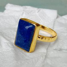 Lapis Lazuli gold ring, 14k yellow gold Lapis Lazuli ring, Lapis Lazuli jewelry,romantic gift, gold ring, gift for her, cushion lapis stone Lapis is known to activate the third eye chakra and is said to enhance intuition and psychic ability. Lapis is also said to help concentration, absorption and digestion of knowledge, and in teaching skills. The 14K yellow solid gold bezel and solid yellow gold ring are both shined to an extremely high polish. All rings are packaged and shipped in a beautiful ring box. The main stone is natural, shiny, Lapis Lazuli. Gemstone Size Approx : 14 x 10 mm The pictures have been enlarged to show the details. The price is for a 14k gold ring, if you want to order the ring in 18k or 22k gold please convo me prior to purchase. IMPORTANT NOTES This gold jewelry is Lapis Rings For Women, Sapphire 14k Gold Signet Ring Gift, 14k Gold Sapphire Signet Ring As Gift, Anniversary Yellow Gold Lapis Lazuli Rings, Classic Lapis Lazuli Ring As Gift, Classic Lapis Lazuli Ring As A Gift, Yellow Gold Lapis Lazuli Gemstone Rings, Yellow Gold Rings With Lapis Lazuli Gemstone, Blue 14k Gold Signet Ring As Gift