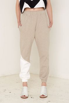 These luxurious cotton fleece trousers are a wonderful example of understated style. The simple yet sophisticated design makes the most of the fabric’s beautiful texture and draws attention to the garment’s gorgeous detailing. The trousers are finished with a touch of bold, contrasting colour, hip pockets and an elasticated waist. These trousers are available in three colours: a gorgeous light blue with white detail around one cuff, beige with white detail, and dark grey and beige. We are commit Ethical Fashion Brands, Sophisticated Design, Grey And Beige, Womens Clothing Sizes, Cotton Fleece, Ethical Fashion, Denim Dress, Contrasting Colors, Jacket Dress