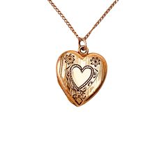 "Vintage 1940s gold filled heart locket with etched heart and floral engraved.  The locket opens with ease and closes with a strong snap.  The locket is marked P&K on the inner frame.  This would make a fantastic addition to any jewelry collection. Locket measures 7/8\" X 3/4\" from the top of its original bale. Weight: 3.85 grams A condition is excellent, with no damages or repairs. The business American Queen Pitman & Keeler was based in Attelboro, MA and they were in business from approximate 1940s Jewelry, American Queen, Engraved Flower, Heart Locket, Locket, Antique Jewelry, Solid Gold, Gold Filled, Jewelry Necklace Pendant