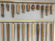 several wooden objects are hanging on the wall