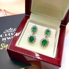 ONE OF A KIND HANDCRAFTED EARRINGS. IN STOCK! READY FOR SHIPPING! GIFT WRAP AVAILABLE! FREE UPS EXPRESS! STUNNING 2.98TCW, Certified Zambian Emerald earrings. UNIQUE DESIGN! ONE OF A KIND! TRANSPARENT, SPARKLING EMERALDS IN PAIR! Extremely rare! Surrounded by TOP GRADE, E/VS DIAMONDS! Set in 18K solid white gold earrings. These earrings will absolutely dazzle anyone who sees them! Our jewelry are specially designed, and are delicately handcrafted by local, professional goldsmiths, who have had d Gia Certified Emerald Earrings For Formal Occasions, Gia Certified Fine Jewelry Earrings For Formal Occasions, Formal Gia Certified Oval Earrings, White Gold Drop Earrings With 17 Jewels, Gia Certified White Gold Teardrop Earrings, Gia Certified Formal Drop Earrings, Formal Emerald Earrings With Prong Setting, Oval Diamond Earrings Hand Set, Gia Certified Dangle Earrings For Formal Occasions