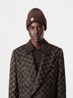 House signature graphics illustrate accessories for Autumn-Winter 2024. The MA Beanie is crafted from knit merino wool and features MA enamel hardware at cuff. AUTUMN-WINTER 2024 COLLECTION MADE IN ITALY 100% EXTRAFINE MERINO WOOL Classic Fitted Wool Beanie, Brown Wool Jacquard Knit Outerwear, Fitted Wool Beanie For Winter, Fitted Wool Beanie For Fall, Brown Wool Beanie For Fall, Brown Wool Beanie For Winter, Winter 2024, 2024 Collection, Merino Wool