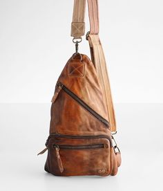 Bed Stu Andie One Shoulder Leather Backpack - Brown , Women's Cafelattetd Distressed leather canvas lined crossbody backpack Zipper closure Interior zipper and pouch pockets Adjustable shoulder strap Dimensions: 8(L) x 13 1/2(H). Due to the nature of leather/suede, small variances of color in the skin may occur, this is in no way considered a defect. These are inherent characteristics of leather/suede and will enhance the individual look of your garment.. Genuine leather. Luggage & Bags > Backpa Leather Sling Bags Women, Western Bags Purses, Rock Revival Jeans Women, Leather Sling Bags, Sling Bags Women, One Shoulder Backpack, Crossbody Backpack, Cafe Latte, Women Leather Backpack