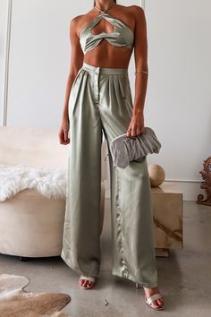 Sage green satin pant set Top ties around neck Bra top with underwire and heart hole cut out Elastic stretchy backing for comfortable fit Pleated wide leg trousers Zipper clip closure Top Lined/Bottom Non Lined Non stretch Runs true to size, Sofia wears size small Polyester, Hand wash cold Paired with the Layla Metal Clutch Sofia's measurements - Height 5'8, Bust 32B, Waist 27 in , Hips 34 in. She normally wears a size small in tops, a size 2 in dresses, and a size 3/25 in jeans. FINAL SALE Satin Set Outfit, Satin Pant, Sage Green Color, Satin Set, Satin Pants, Design Clothes, Fashion Design Clothes, Green Satin, Satin Material