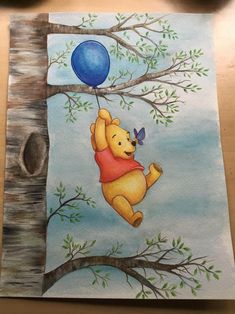 a painting of winnie the pooh hanging from a tree with a blue balloon on it