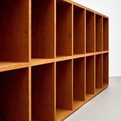 a wooden shelf with several compartments on each side