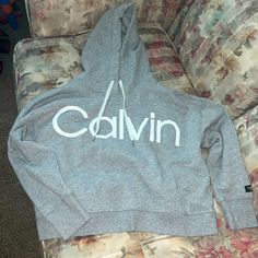 Size Large Grey Calvin Klein Cropped Hoodie With White Strings. Never Worn, Brand New Without Tag. Calvin Klein Sporty Sweatshirt With Ribbed Cuffs, Calvin Klein Crew Neck Sweatshirt With Ribbed Cuffs, Calvin Klein Sweatshirt With Ribbed Cuffs For Streetwear, Calvin Klein Winter Sweatshirt With Ribbed Cuffs, Calvin Klein Hoodie With Drawstring Hood For Winter, Calvin Klein Winter Hoodie With Drawstring Hood, Calvin Klein Crew Neck Tops For Loungewear, Calvin Klein Sporty Hoodie For Streetwear, Calvin Klein Cotton Sweatshirt For Spring