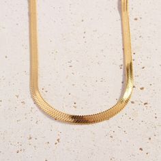 A must-have for any growing collection, add a touch of shimmer to your look with the subtle link design of our 18k gold plated Cali Chain. Mix and match this piece with your fave Cali Tiger pendants and layered chains like the trend setter we know you are!    Please note we frequently sell out of this item. We advise you to place your order while it is available to avoid any disappointment.  Details:   Total length 50cm   Chain 5mm Width   18k Gold Plated   FREE Insured Shipping (Worldwide) Elegant Gold Herringbone Necklace With Curb Chain, Chic Gold Snake Chain Necklace, Chic Gold Herringbone Necklace With Adjustable Chain, Chic Gold Herringbone Chain Necklace, Delicate Gold Snake Chain Necklace For Formal Occasions, Formal Gold Snake Chain Necklace With Delicate Chain, Chic Herringbone Snake Chain Necklace, Chic Gold Herringbone Necklace With Clavicle Chain, Chic Gold Herringbone Necklace With Delicate Chain