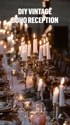 a long table with many lit candles on it and place settings in front of them