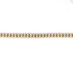 This breathtaking 5 Carat Bar Set Diamond Tennis Bracelet in 14k Yellow Gold is the perfect gift for a special occasion. The elegant and sporty bracelet features eighty-eight (88) .056 carat round brilliant cut diamonds. The diamonds are set in pairs in-between stylish 14 karat yellow gold channel bars. Geometric, sparkling, and expertly designed. The bracelet measures 7.52 inches long. A modern beauty in diamonds and yellow gold! Pair with some diamond earrings to complete the look! Metal Shop, Tennis Bracelet Diamond, Bar Set, Shop Engagement Rings, Tennis Bracelet, Round Brilliant Cut Diamond, Brilliant Cut Diamond, Shop Necklaces, Shop Earrings