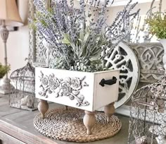 a white planter sitting on top of a wooden table