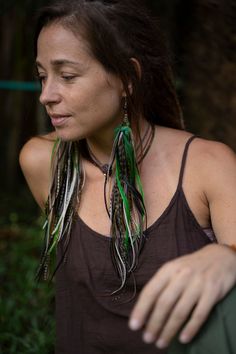 Extra long feather earrings in bring Green color.  With beads of smoky quartz and hypoallergenic silver hooks.  The shade of feathers may be slightly different because of natural material is always unique. Made with love and inspiration ✨ Green Bohemian Feather Earrings, Green Bohemian Earrings With Feathers, Bohemian Green Feather Earrings, Earrings With Feathers, Green Feather, Festival Earrings, Feather Earrings, Natural Material, Bright Green