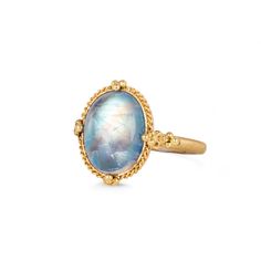 This oval Moonstone shimmers with iridescence, revealing faint orange streaks through a blue wash. This enchanting gem is set in a meticulously hand-crafted gold setting with braided gold and granulated prongs. One-of-a-kind.Ready to ship in size 7. Please allow 1-2 weeks for any other size. Technical Details Metal: 18k yellow goldMoonstone: 6.4 cts. Ring face: 16mm x 13mmBand width: 2mmHandmade in New YorkStyle # R-2709-MO Gold Oval Moonstone Ring With Gemstone Accents, Heirloom Yellow Gold Moonstone Ring, Oval Cabochon, Heirloom Yellow Gold Oval Cabochon Moonstone Ring, Heirloom Yellow Gold Moonstone Ring, Luxury Gold Moonstone Ring Oval Cabochon, Luxury Gold Moonstone Ring With Oval Cabochon, Celestial Oval Cabochon Moonstone Ring, Luxury Gold Oval Cabochon Moonstone Ring, Hand Forged Oval Moonstone Ring