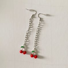 these fun cherry drop earrings are perfect for any occasion! these earrings are handmade from metal and are non-hypoallergenic. keep away from water for best wear and longevity. Trendy Cherry Dangle Earrings, Trendy Cherry-colored Earrings, Cherry Nickel-free Trendy Jewelry, Cherry Color Trendy Nickel-free Jewelry, Trendy Cherry Nickel-free Jewelry, Cute Cherry Dangle Jewelry, Cherry Dangle Earrings With Ear Wire, Cherry Colored Drop Earrings With Ear Wire, Cherry Drop Earrings With Ear Wire