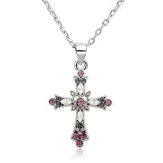 Elegantly crafted from a stainless steel silver metal, this accessory boasts its no-rust, no-fade, and anti-allergenic features. Aside from being a comfortable piece to wear, this silver cross pendant is stunning. Multiple cubic zirconia crystals are embedded all over the pendant, in varying shapes and sizes. The centerpiece is a round pink crystal placed inside a carved out heart. The surrounding crystals are a mix of purples, whites, and other pink shades. This lovely pendant from Innovato Design comes with a silver link chain necklace.  Product Highlights:    Long silver chain necklace (Length: 18")  Lovely Silver Cross Pendant with Crystals  Made from rust-proof and fade-proof stainless steel Chain Link Necklace Silver, Necklace Woman, Jesus Piece, Purple Cross, Flower Cross, Christian Necklace, Silver Link Chain, Inspirational Jewelry, Silver Cross Pendant