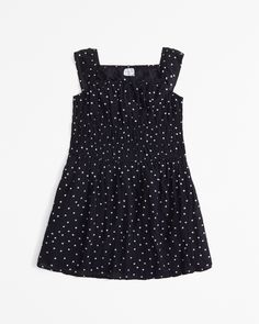 Versatile mini dress in a soft cotton fabric, featuring a smocked waist and bow detail. Girls Smock, Abercrombie Kids, Dress Girls, Girls Rompers, Black Polka Dot, Dress Romper, Bow Detail, Kids' Dresses, Smocking