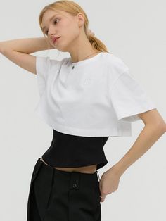 This double-layered t-shirt features sleeveless and short sleeved panels. It is accentuated with signature logo embroidery detail at chest.  - Natural, regular fit- Basic crewneck and short sleeved design- Unique layered panels at hem- Comfortable dropped shoulders- Casual, stylish mood White Short Sleeve Top For Layering, White Crew Neck Crop Top For Layering, Summer Short Sleeve Crop Top For Layering, Basic Crewneck, Layered Short, Layered T Shirt, Casual Stylish, Embroidery Details, Logo Embroidery